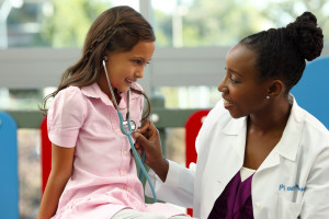 Doctor and girl with stethoscope