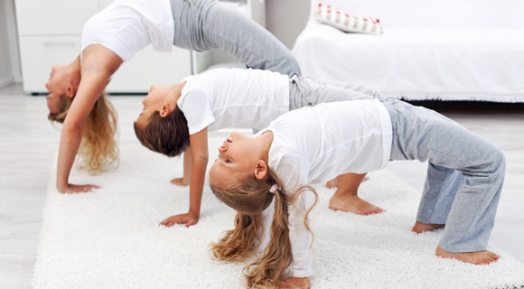 Children doing yoga pose