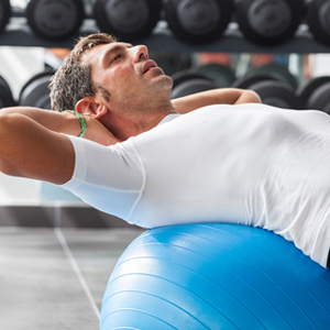 Man working out on a fitness ball