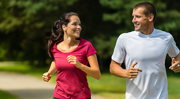 Couple running smiling