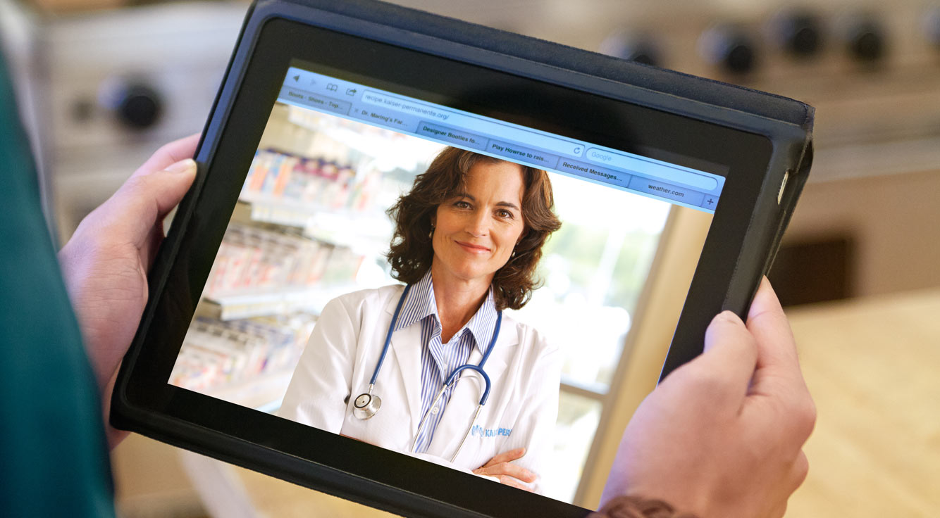A tablet screen shows a doctor.