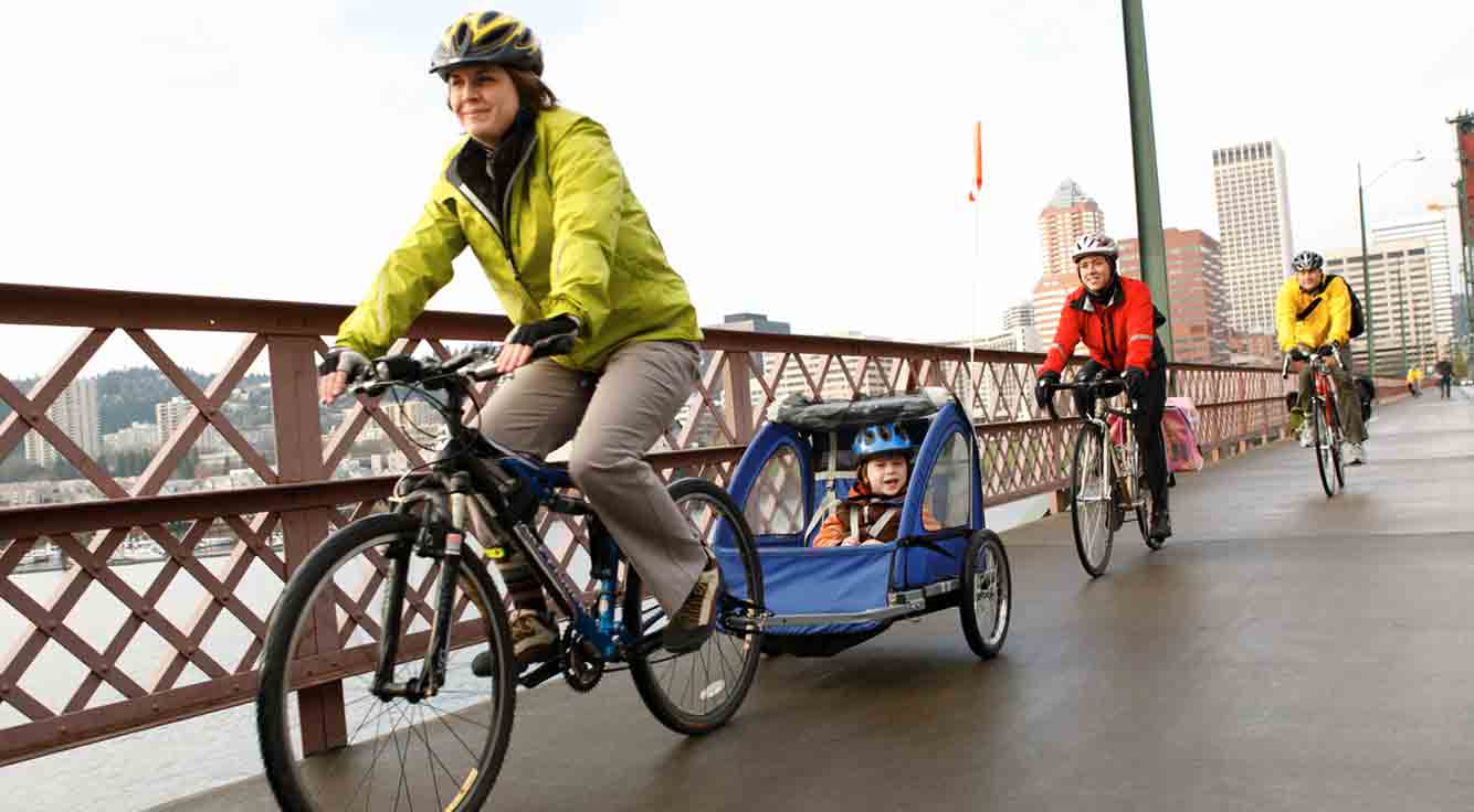A woman and her family ride bikes on a chilly day.