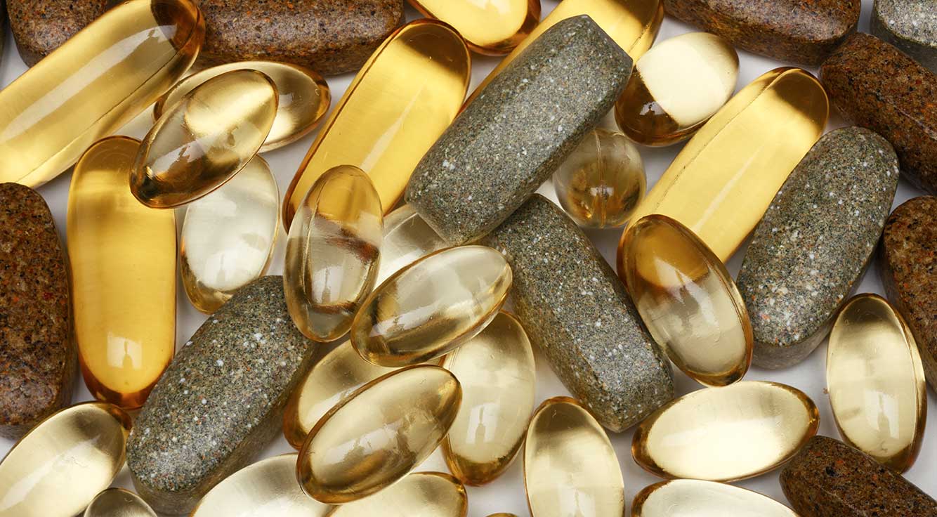 A pile of yellow and gold supplements.