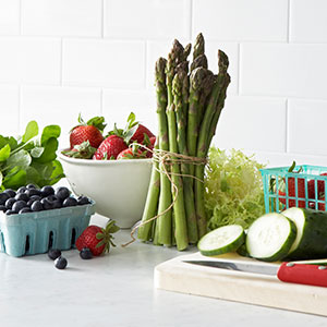 Assorted fruits and vegetables on a kitchen counter