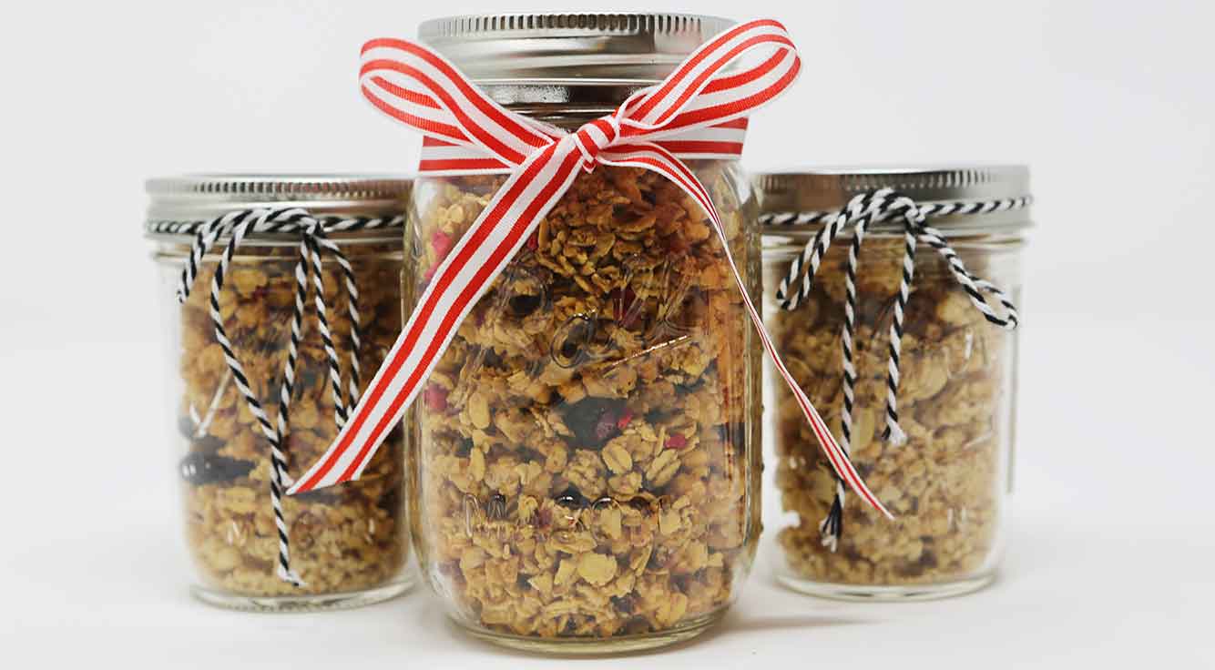 3 mason jars tied with bows and filled with tasty granola