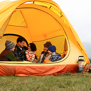 A happy family in a tent on a camping trip