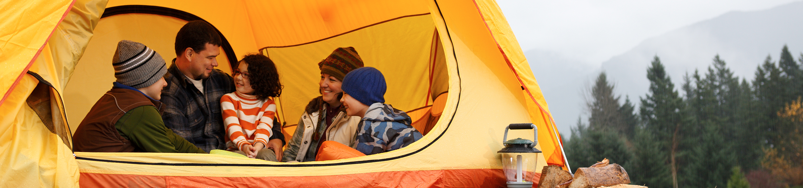 A happy family in a tent on a camping trip