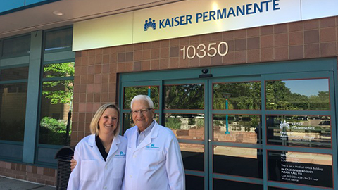 doctors in front of a kaiser permanente office