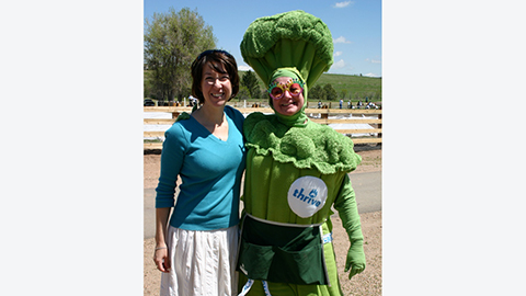 woman dressed up as broccoli for a kaiser permanente thrive event