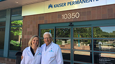 doctors in front of a kaiser permanente office