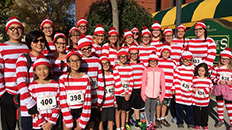 parents and kids dressed as cat in the hat